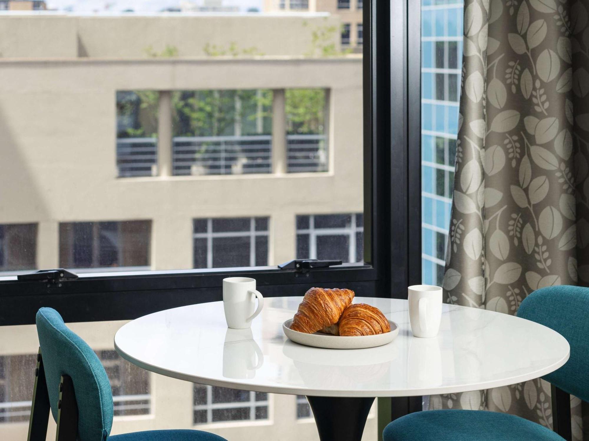 The Olsen Melbourne Art Series Экстерьер фото A table and chairs